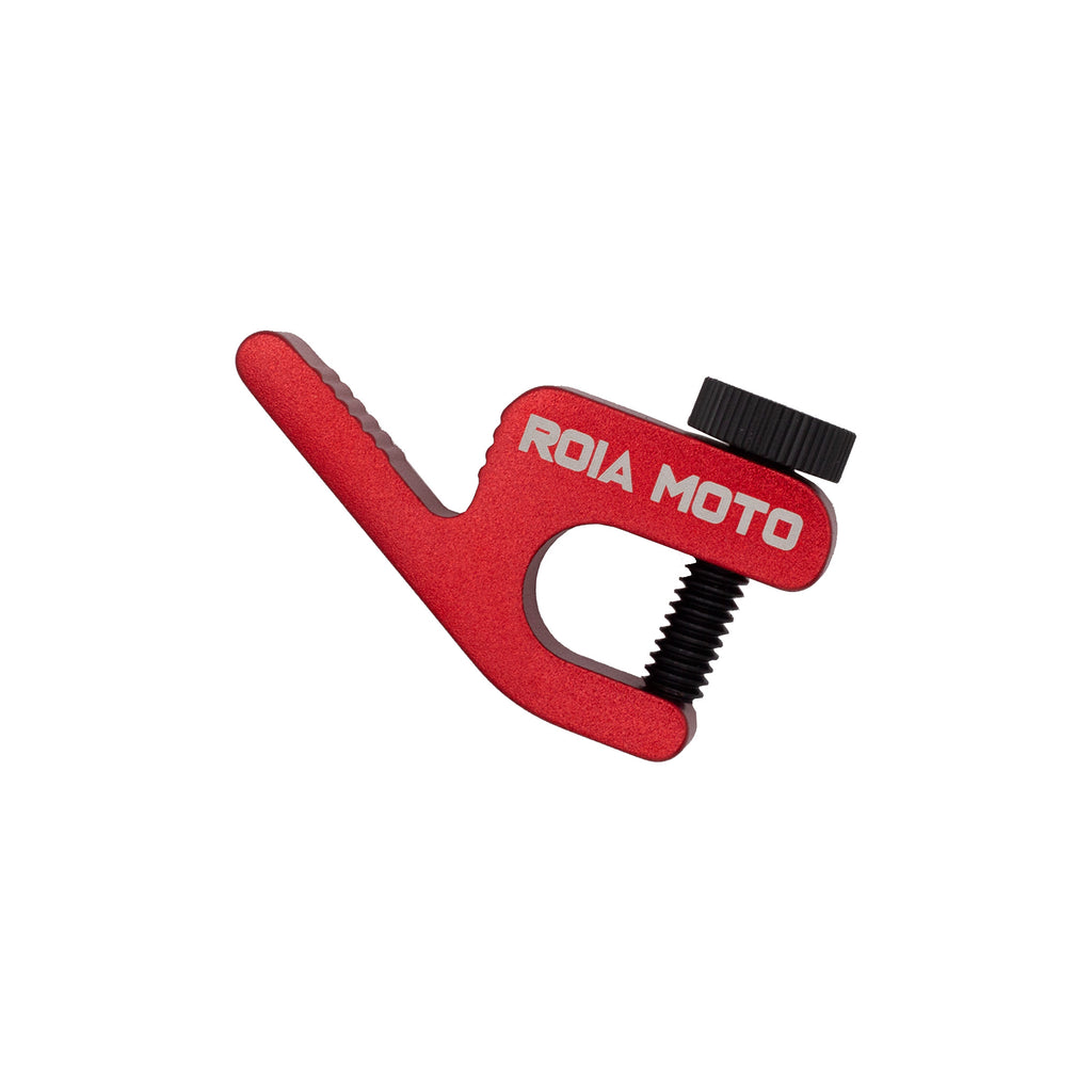ROIA MOTO tire bead retainer in red aluminium with black clamping screw, flat studio shot on white background